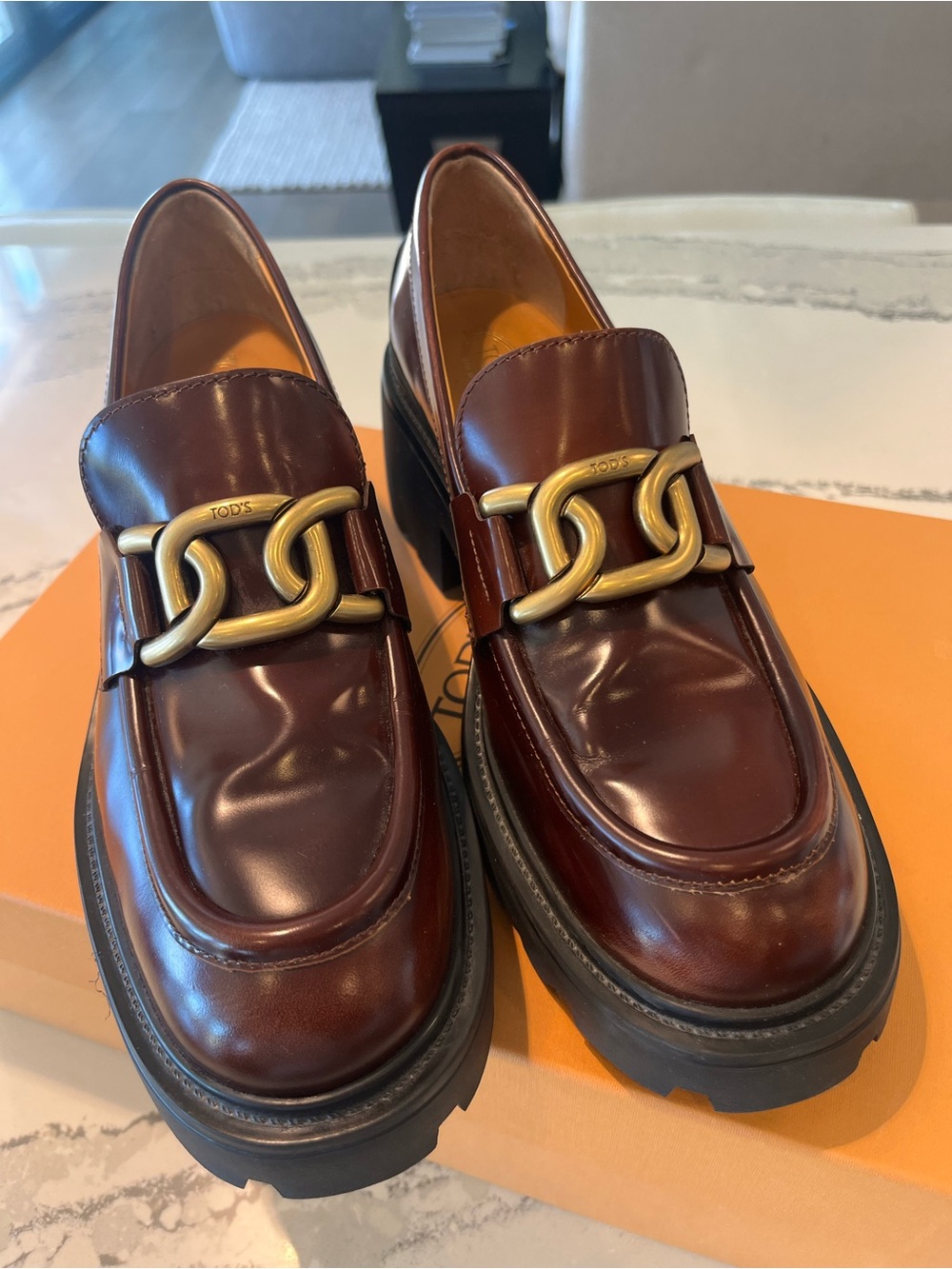Tod's Burgundy Leather Loafers with Gold Chain Detail